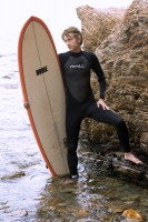Surfer on the Rocks